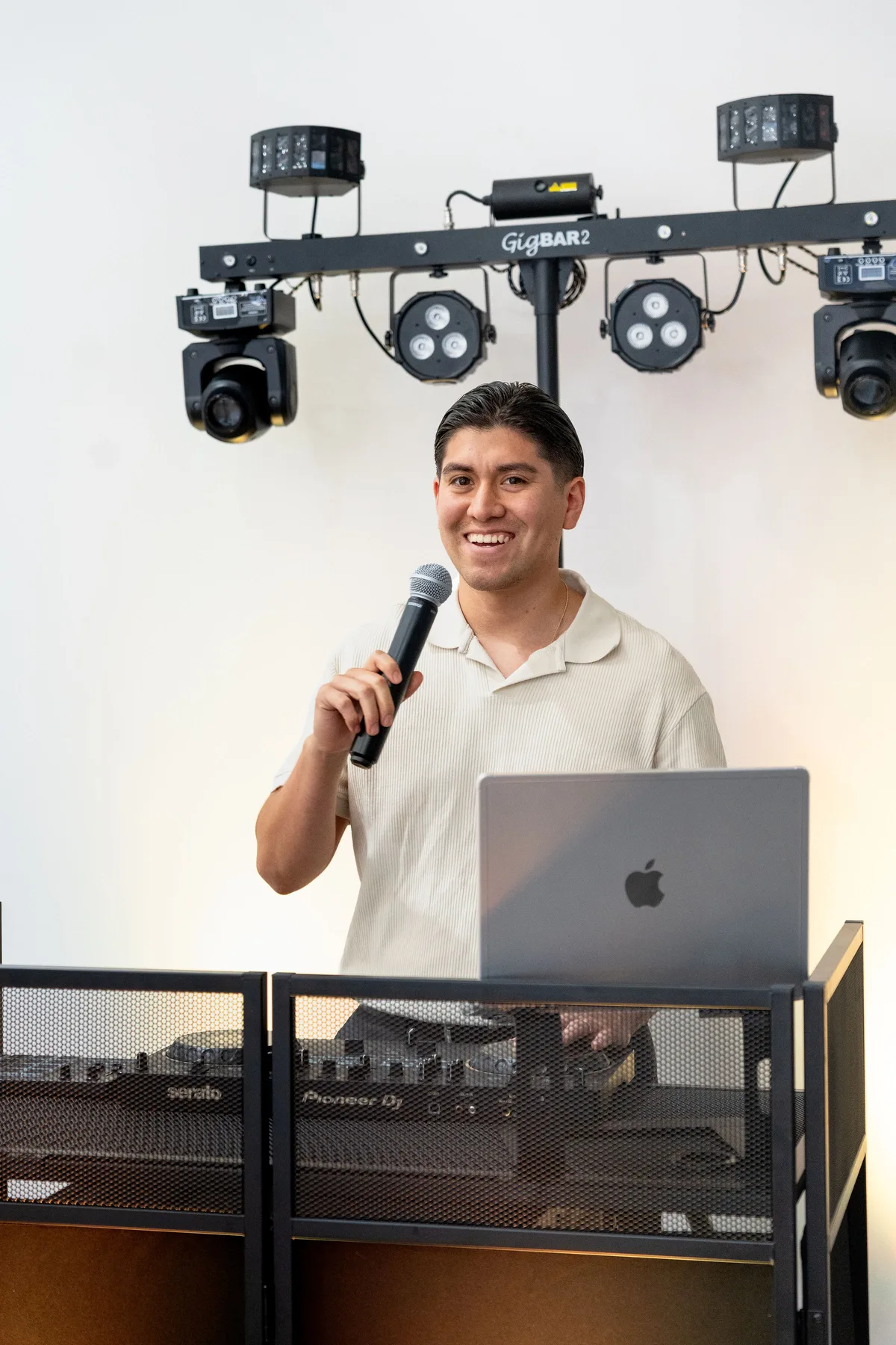 DJ Foca using a microphone while performing as a DJ and MC