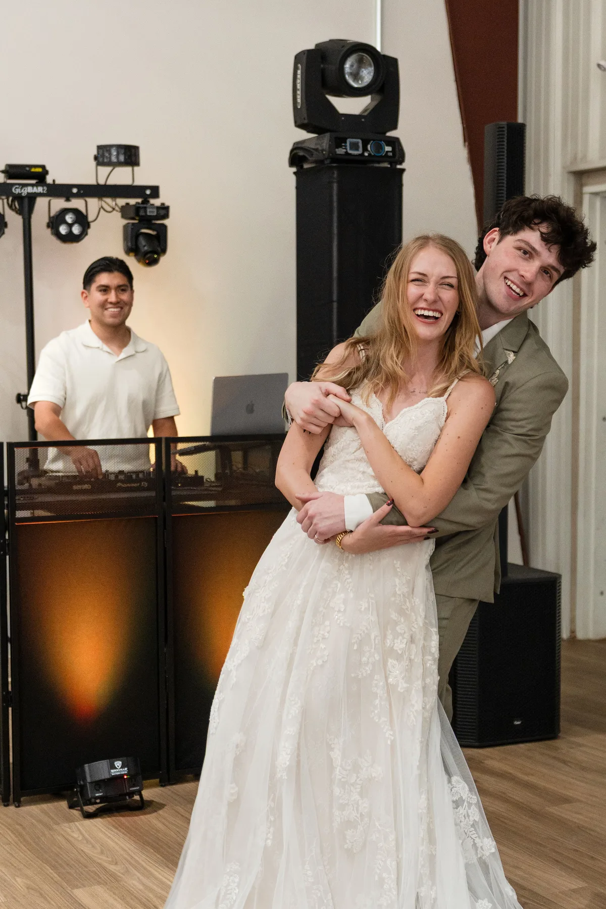Wedding couple celebrating while DJ Foca performs